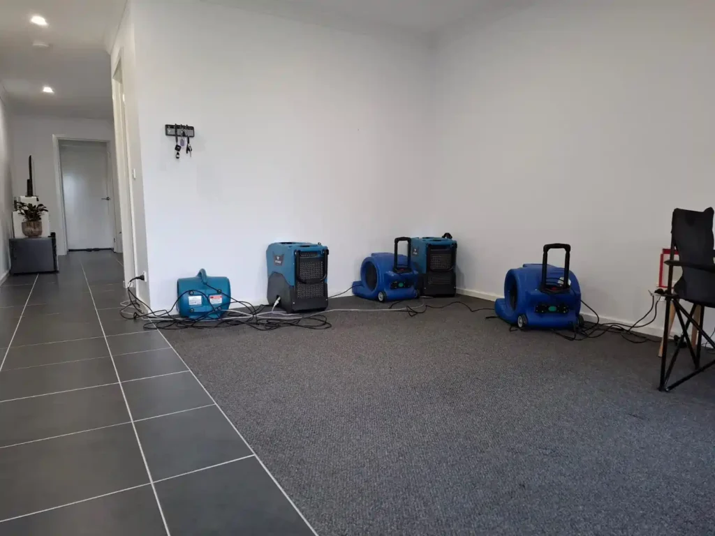 Burst pipe water damage in Geelong with professional water extraction and restoration in progress